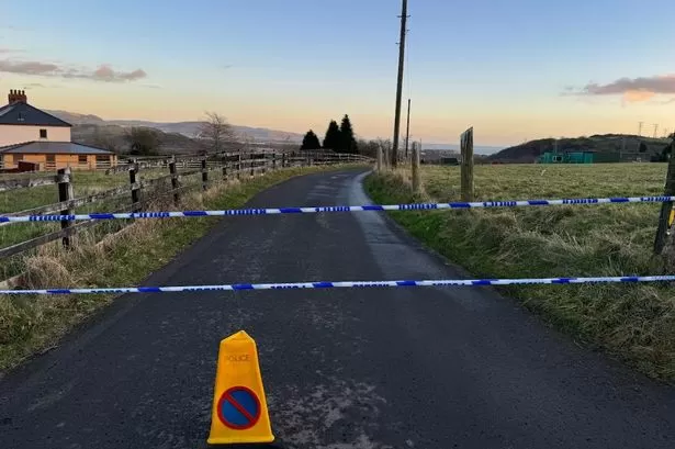 Police at scene as trapped lorry shuts road