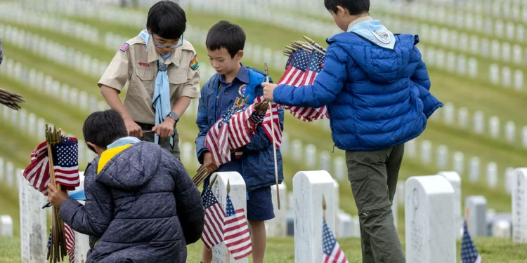 Photos: Scouts and volunteers place over 100,000 flags for Memorial Day
